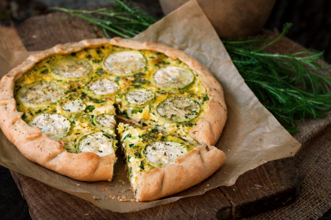 Homemade,Courgette,And,Goat,Cheese,Pie,On,A,Dark,Rustic