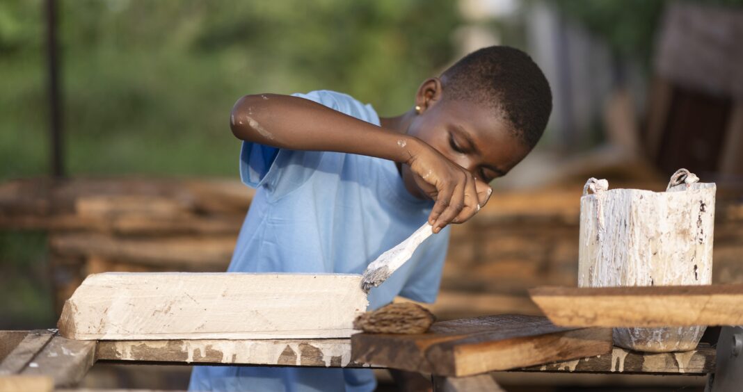 medium-shot-kid-painting-wood